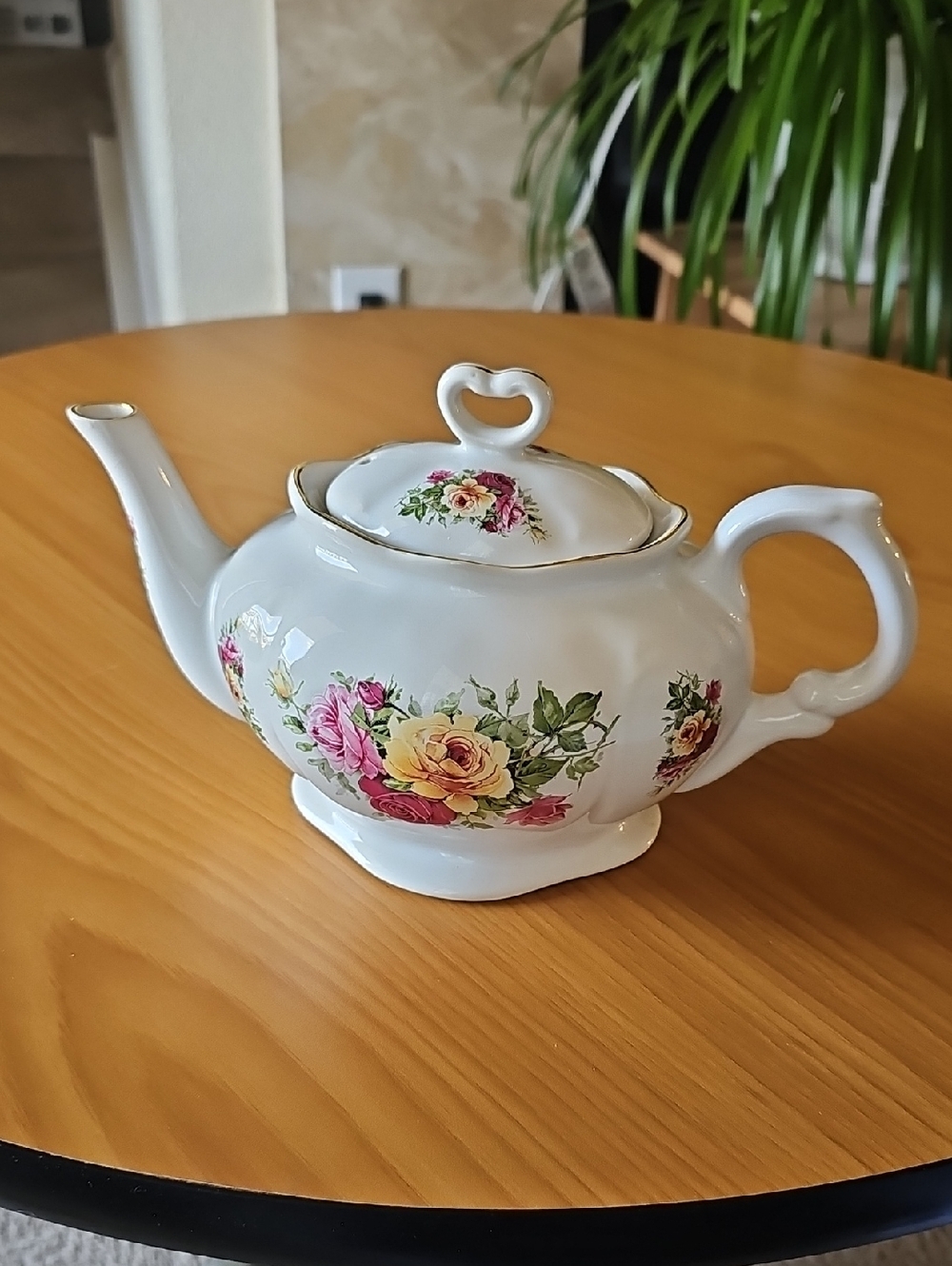 Classic White Porcelain Teapot with Pink and Yellow Floral Accents